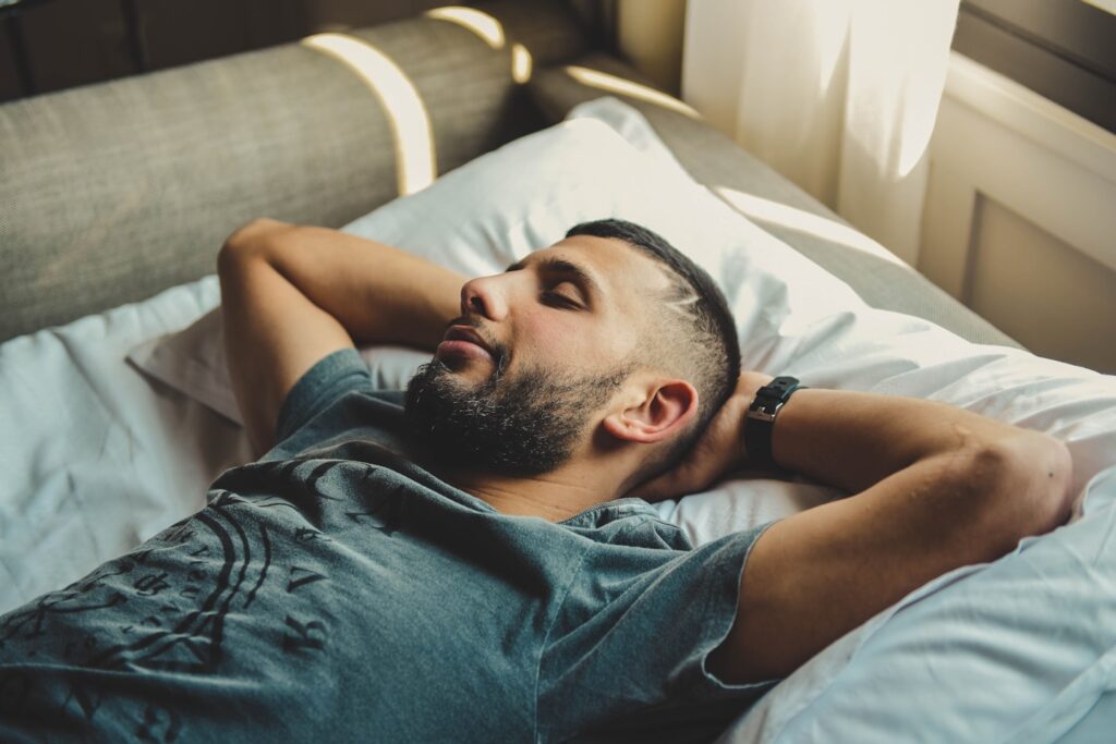 man lying on bed