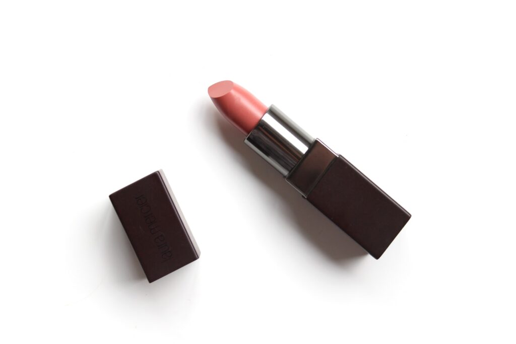 Flat-lay of nude pink lipstick for use as cosmetics and makeup